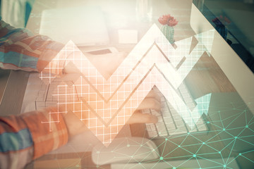 Growing arrows with businessman working on computer on background. Success concept. Double exposure.