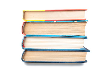 Group of books stacked vertically isolated on white