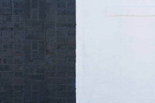 Brick wall painted in black and white