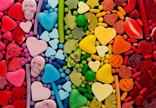 Assortment of candy ordered in rainbow colors