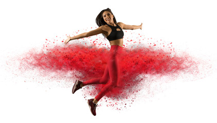 Girl wearing red leggings jumping with red dust  - Image