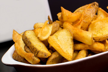 Rustic french fries in a pub table close