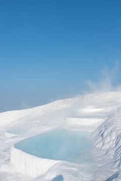 Steamy spring water in limestone
