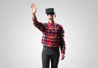 Guy in mask experiencing virtual reality as new entertainment device