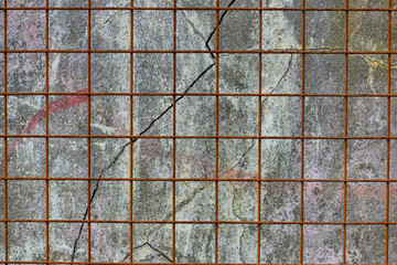 Texture, wall, fence net, it can be used as a background. Wall fragment with scratches and cracks.