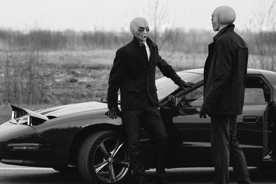 Aliens and a car on the abandoned road