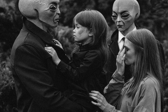 Aliens, woman and weird child