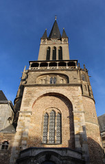 Fototapeta na wymiar Tower of Aachen Cathedral. West Facade of Aix-la-Chapelle, Roman Catholic church in Aachen, western Germany.