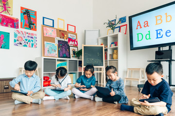 Students learning with digital tablets