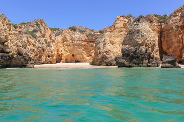 Fototapeta na wymiar Algarve, panoramic landscape view of golden cliffs and emerald water in Ponta da Piedade, Lagos, Algarve, Portugal
