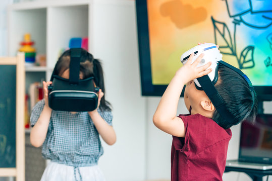 Preshool kids wearing virtual reality headset in classroom
