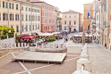 Ancona, Italy - June 8 2019: People enjoying summer day and food at outdoor restaurant and resting.
