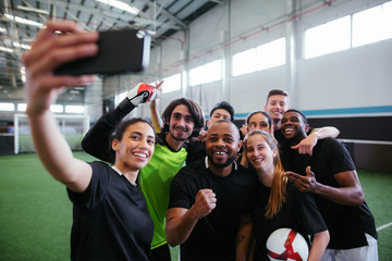 Team soccer players taking a selfie.