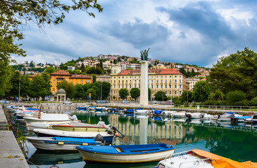 Rijeka, Croatia: Rjecina river with Liberation Monument, boats and view over the city and Trsat...
