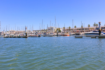 Fototapeta na wymiar Marina of Lagos, yachts and boats moored in the marina, Lagos, Algarve, Portugal, Europe.