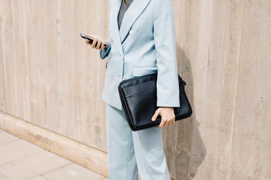 Crop Businesswoman In Blue Suit Using Phone