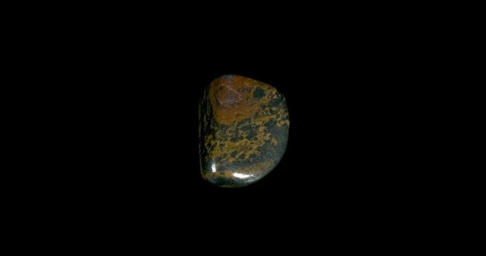 Iron Tiger Eye Mineral Turning on Black