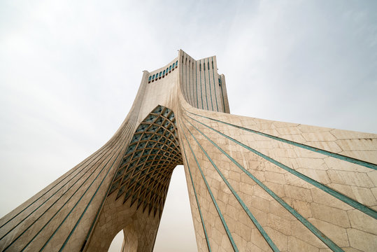 Modern tower and cloudy sky