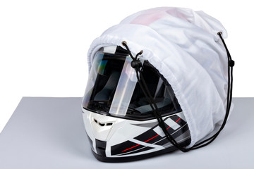 A white helmet full face of motorcycle inside its case isolated