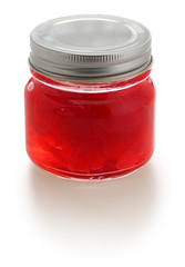 homemade rose petal jam in glass jar isolated on white background