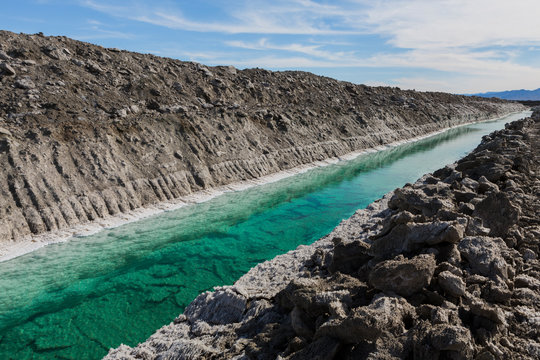 Calcium chloride mine tailings and canal in desert