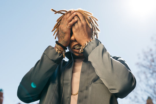 Black man in golden accessories