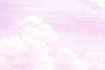 The abstraction is a sky of pink color and white clouds through which the sun's rays make their way.