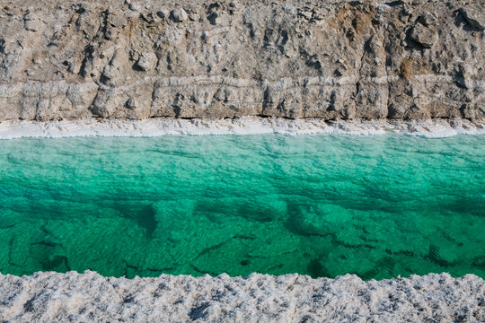 Calcium chloride mine tailings and canal in desert