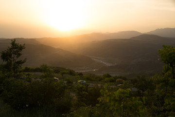 Beautiful landscape in the mountains with the sun at dawn. Mountains at the sunset time. Azerbaijan Caucasus Mountains. Agsu pass. Baskal. Nature