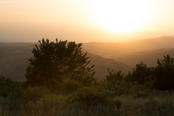 Beautiful landscape in the mountains with the sun at dawn. Mountains at the sunset time. Azerbaijan Caucasus Mountains. Agsu pass. Baskal. Nature