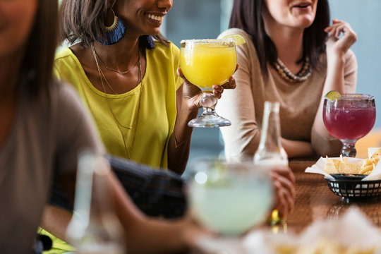 Cinco: Group Of Friends At Bar Drinking Beer And Margaritas