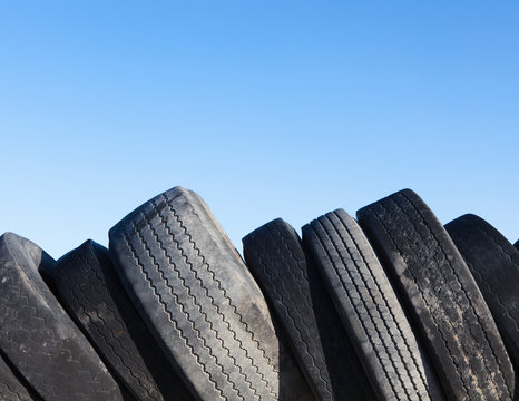 Row of discarded automobile tires in landfill