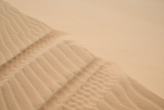 Abstract background of wind effect on dunes at desert.