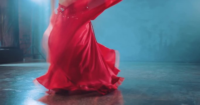 Beautiful swing skirts in dance, oriental style. Belly dance, movement of the hips. Bottom view.