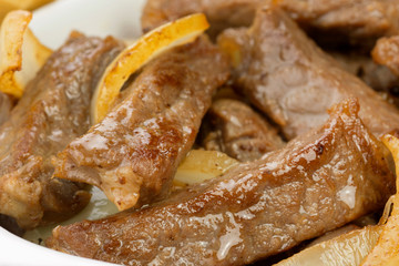 Traditional Brazilian pub food striploin with onions close