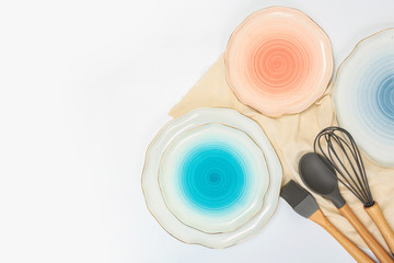 Set of colored ceramic plates on white background