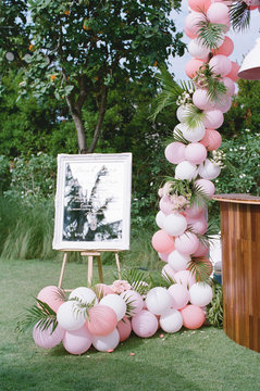 Outdoor wooden & mirror bar sign with tropical and playful decor