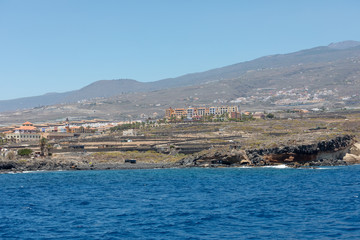 Beautiful rocks at beach with waves and blue water in Teneriffa