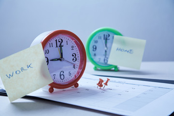 Time management deadline and schedule concept: stickers pasted on the table clock and red pushpin