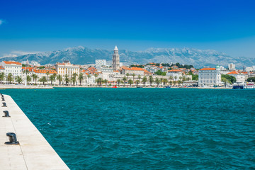 Fototapeta na wymiar City center, cathedral tower, boats and yachts in marina of Split, Croatia, largest city of the region of Dalmatia and popular touristic destination, beautiful seascape 