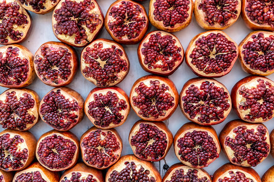 Fresh, healthy, organic, and local pomegranate produce and fruit sold in an open air market in Tel Aviv, Israel.