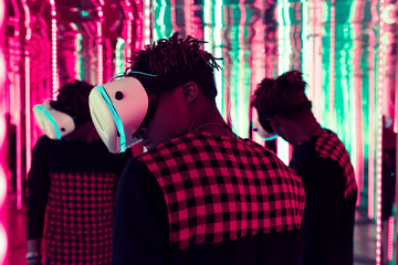 Man in VR glasses in neon lights