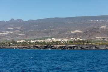 Fototapeta premium Beautiful rocks at beach with waves and blue water in Teneriffa