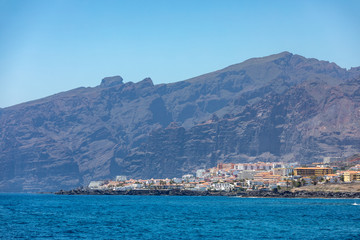Beautiful rocks at beach with waves and blue water in Teneriffa