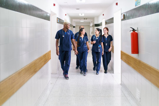 Team of doctors walking in a corridor