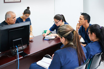Doctor teaching medicine students