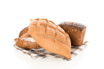 Bakery products on kitchen towel isolated on white background