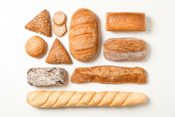 Flat lay composition with bakery products on white background, space for text