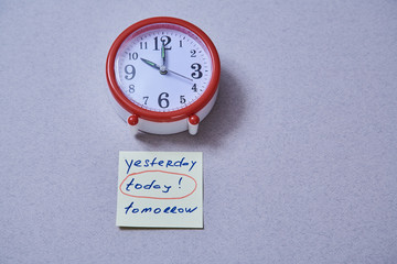 Time management deadline and schedule concept: alarm clock and stickers with different inscriptions