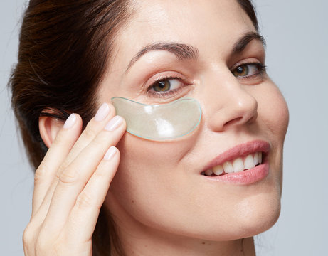 Woman Using Gel Eye Patch Mask